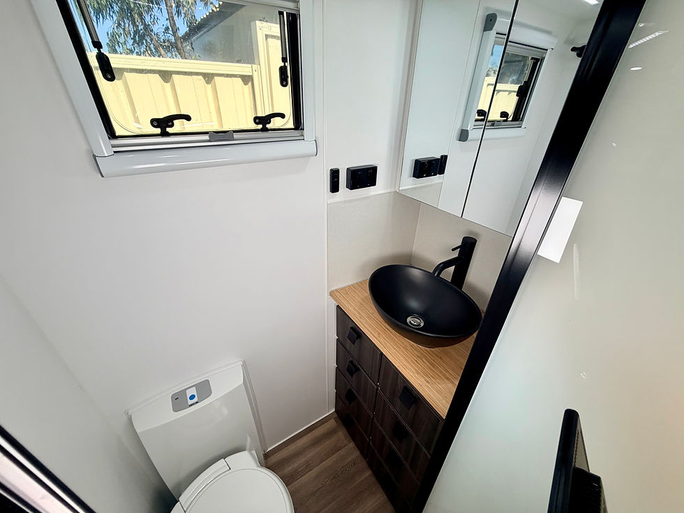 Thumbnail: Hilltop Thredbo 22 foot caravan ensuite interior – spacious full-frame luxury caravan bathroom