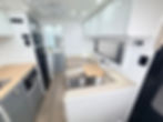 Thumbnail: Hilltop Feathertop Mid Door caravan kitchen and seating – compact single axle family caravan interior