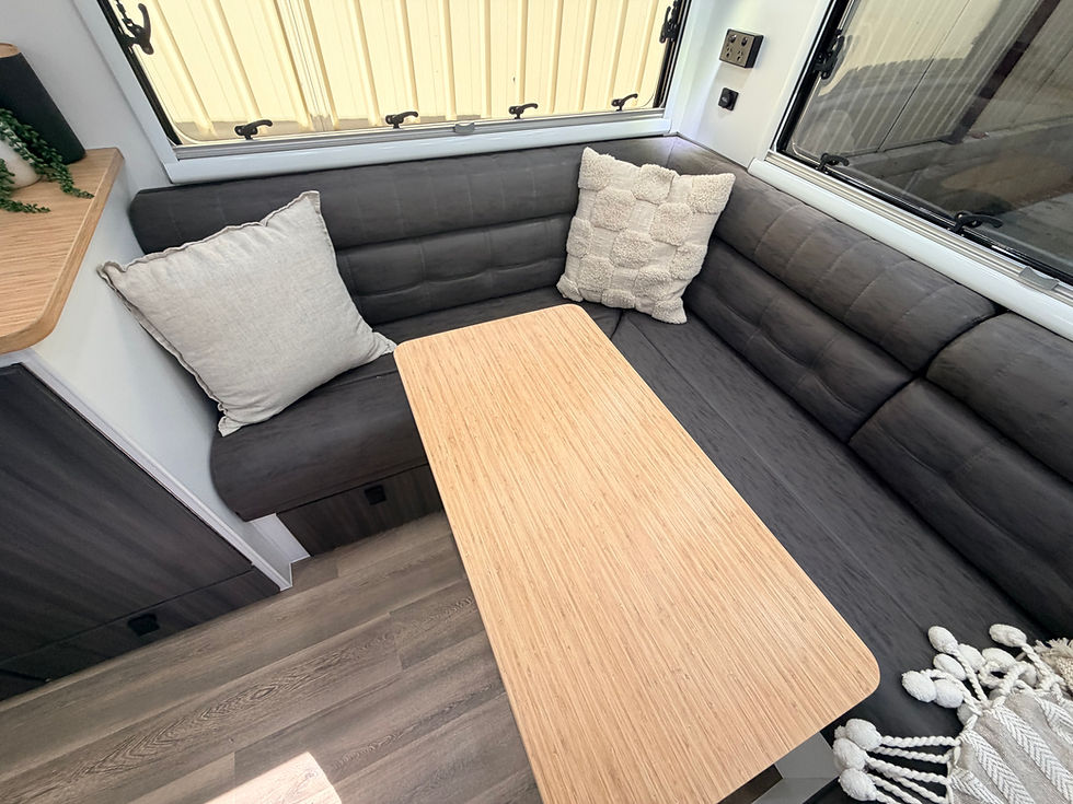 Thumbnail: Hilltop Thredbo caravan club lounge with hydraulic table – premium Australian-built luxury caravan