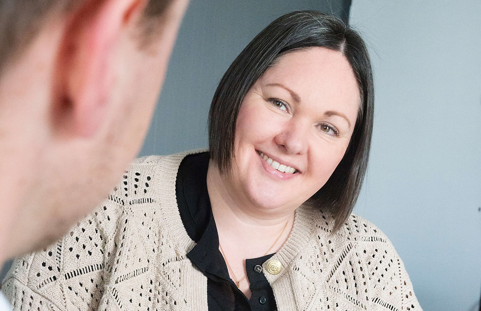 Johanne Jefferson of Ivyhill Digital listening to a client during a meeting.