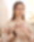 Woman with hands on chest, eyes closed, meditating; Energy Healing present.
