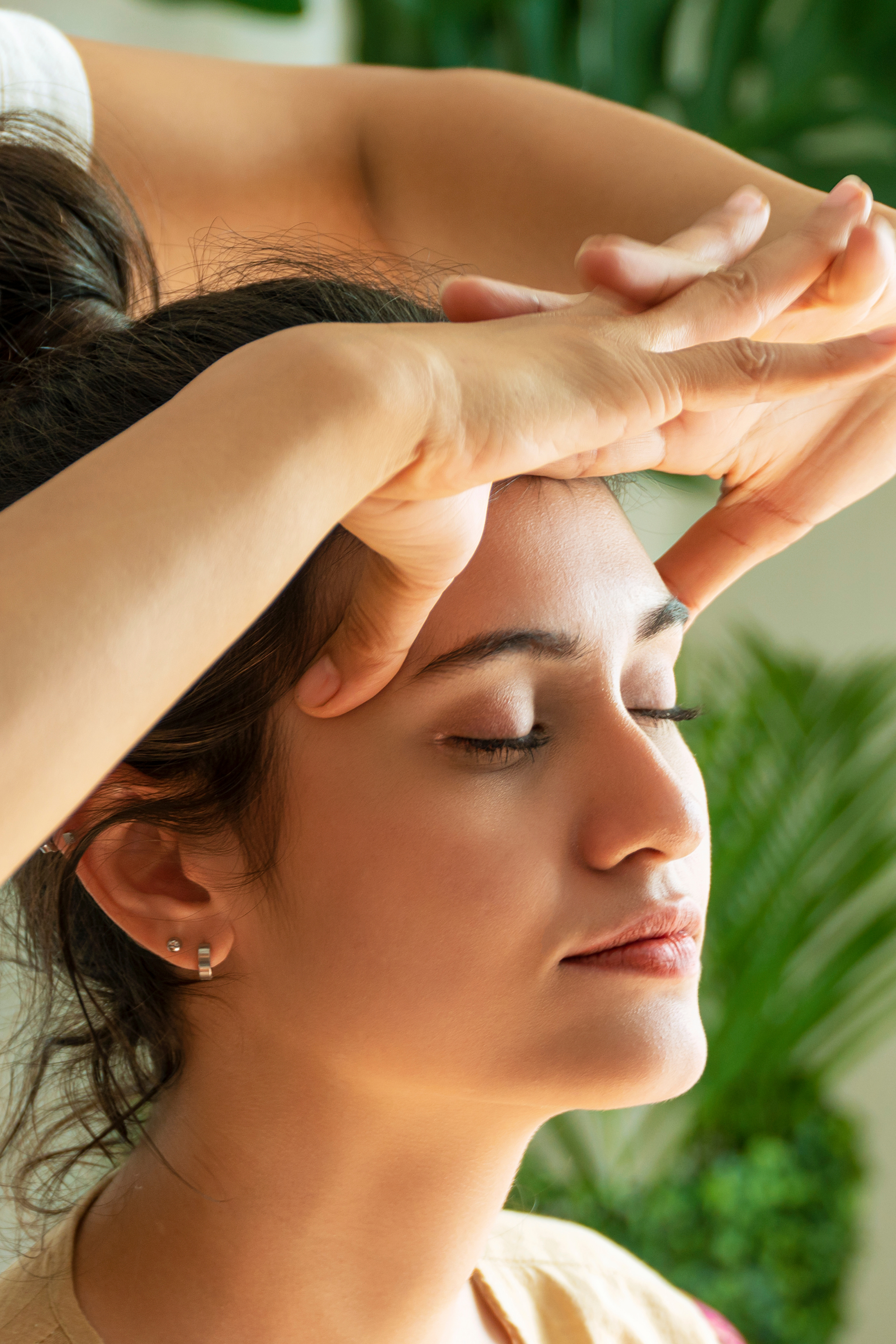 Therapist massaging the back of a person; wellness, health and relaxation.