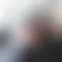 Mid skin fade with the top as short as the fingers can go, with a faded clean cropped beard