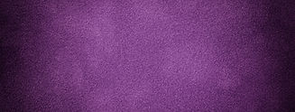 Dark purple matte background of suede fabric with vignette, closeup. Velvet texture of sea