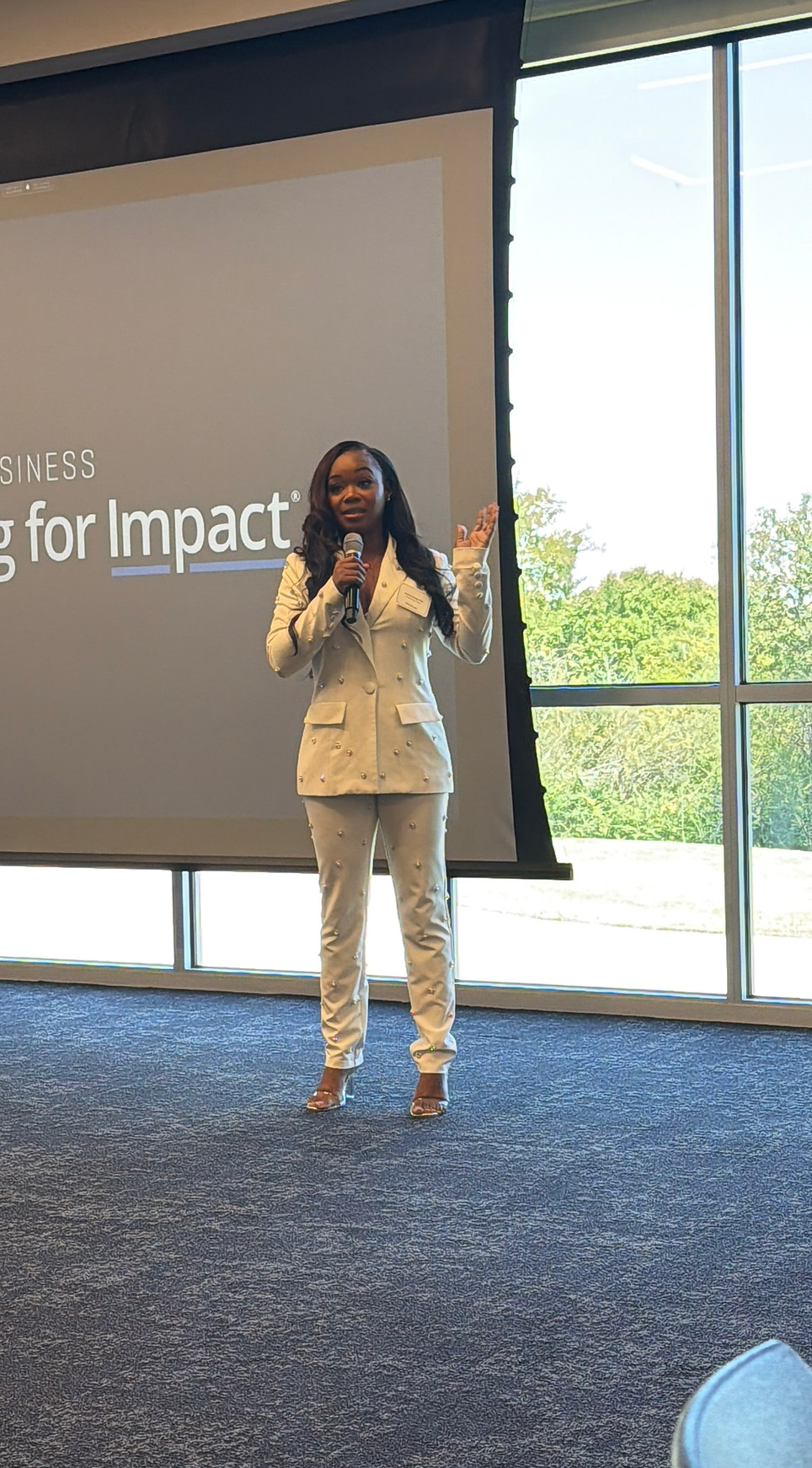 Khiana Rios, founder of the beauty bridge salon suites, teaching beauty entrepreneurs about business growth