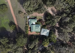 Aerial view of Secrets To 0Serenity Forest Spa surrounded by native forest at Serenity House Pemberton.