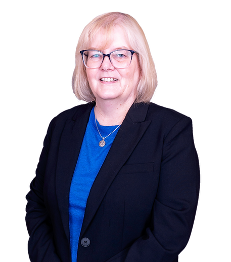 A headshot photo of Donna Edwards. She is wearing a royal blue shirt under a navy blue blazer. She also is wearing eye glasses & a gold necklace with a charm.