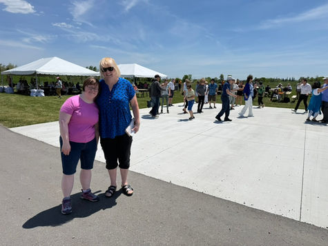 Donna Edwards & her daughter are standing at a 55+ (Seniors') barbecue outside of the Audley Recreation Centre in Ajax.