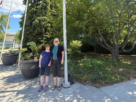 Donna Edwards & her daughter are standing out the Town of Ajax Town Hall celebrating the flag raising recognizing National AccessAbility Week.