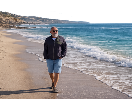 older man walking on beach