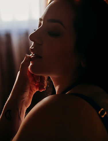 GFE Escort side profile moody lighting