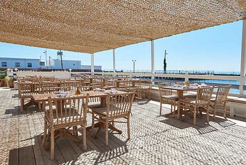 Waterfront dining at Duryea’s Orient Point, featuring scenic harbor views and fresh seafood, ideal for a dock and dine yacht charter experience.
