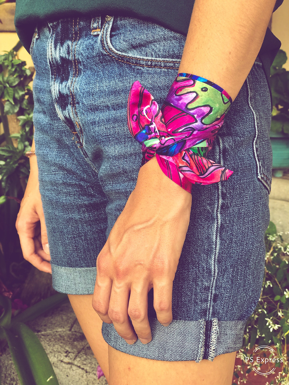 CARMENTA - model wearing wrist ribbon knot tutorial, Costa Rica design and art printed on fabric