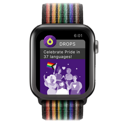 Apple Watch with Pride wristband, featuring a notification that the app Drops now offers lessons on Pride in 37 languages
