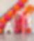 Pink and orange balloon arch with letter A and floral backdrop