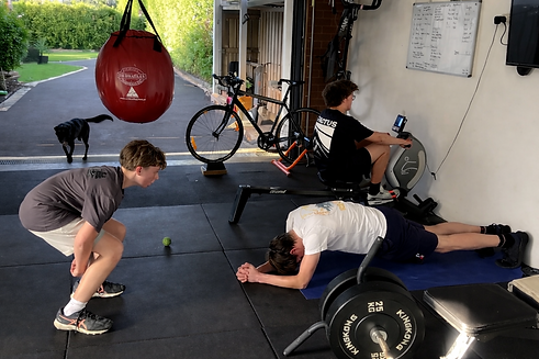 Teenage boys working out in garage gym.png