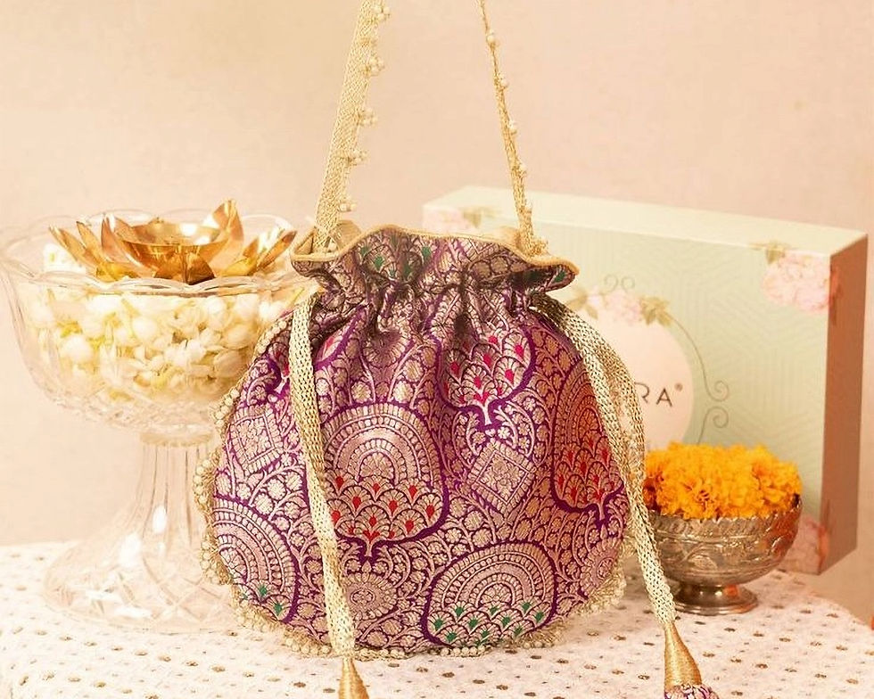 Eye-level view of a beautifully embroidered potli bag on a textured surface