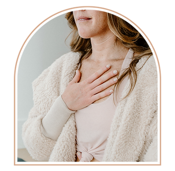 Woman's hand on heart as she meditates