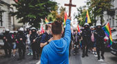 15-year-old boy holding crucifix blocks LGBT march in Poland