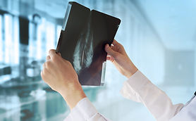 Doctor Examining X-Ray