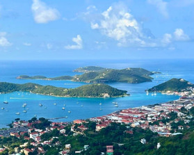 Panoramic view over red-roofed town and turquoise coves of St. Thomas, Virgin Islands