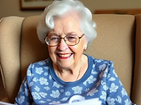 Grandma in a nursing home smiling at a coloring page she got from a grandchild.png