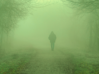 person walking into fog representing the fog of confusion around relational captivity and coercive control & manipulation