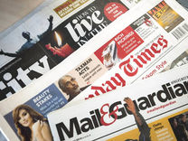 stack of south africa's biggest newspaper publications