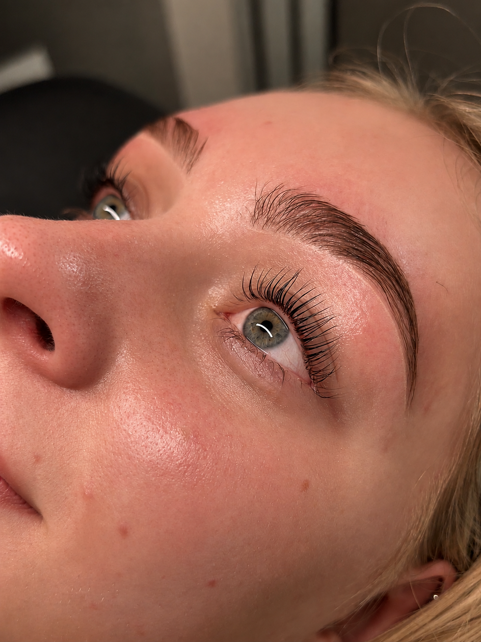 Close-up of brushed-up laminated brows with a natural finish