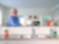 Friendly cleaner smiling at camera in bright, clean kitchen