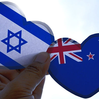 Hand holds a heart Shape Israel and New Zealand flag, love between two countries_edited_edited_edite