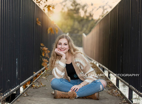 senior girl at sunset on bridge.jpg
