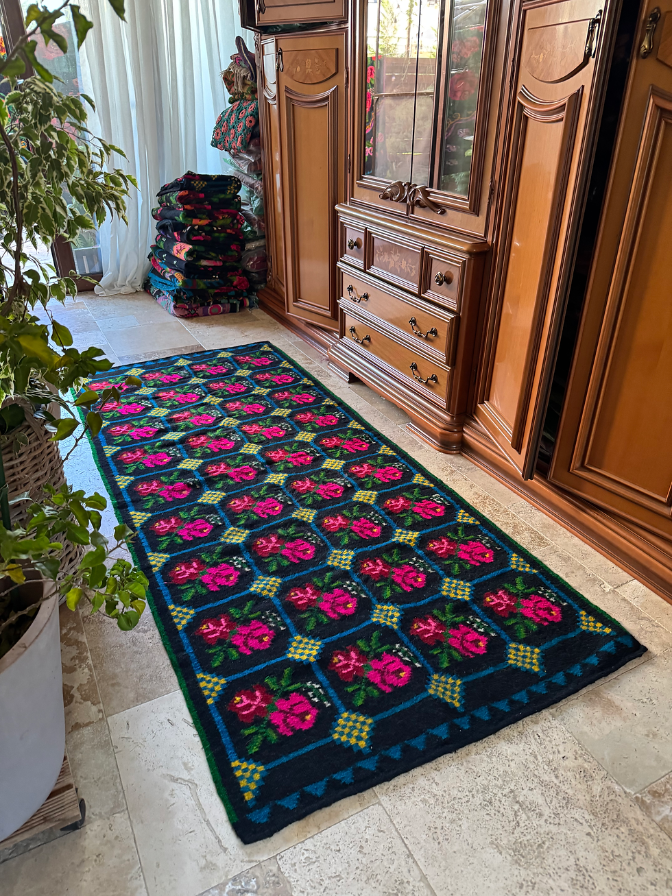 Thumbnail: Colorful handwoven carpet with pink roses