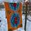 Miniature : Cross stitched wall hanging tapestry  flowers on orange background 