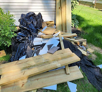 Construction debris and wood scraps ready for junk removal in Charlotte Vermont