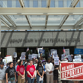 Protesters Rally Outside Whipple Building Over ICE Arrests of Asylum Seekers