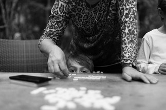boy plays Bananagrams with his grandmother