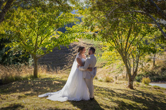 posed photo of a married couple in a garden