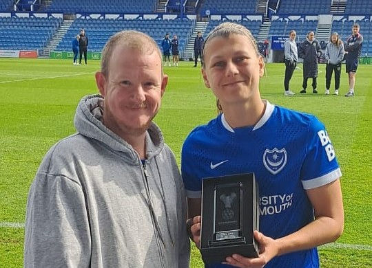 The PWSC present Emma Jones with her 100 appearance trophy