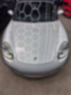 Silver Porsche car with hexagonal pattern