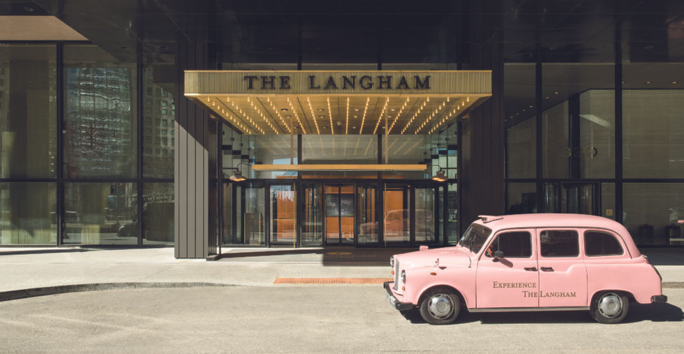 Hotel entrance with pink car