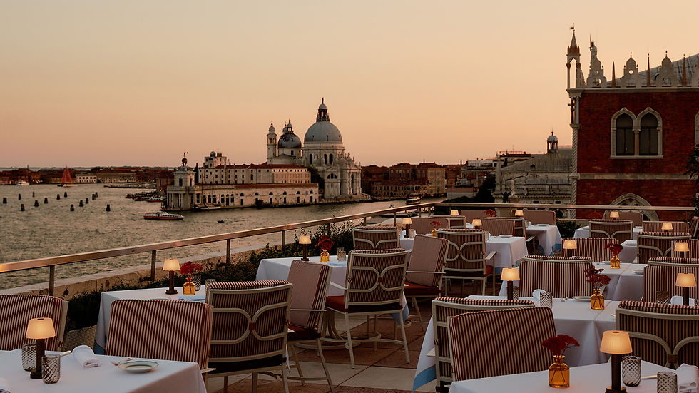 Terrazza Danieli rooftop restaurant overlooking Venice at golden hour