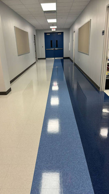 Vibrant school hallway featuring newly waxed floors, providing a clean and safe environment for students.
