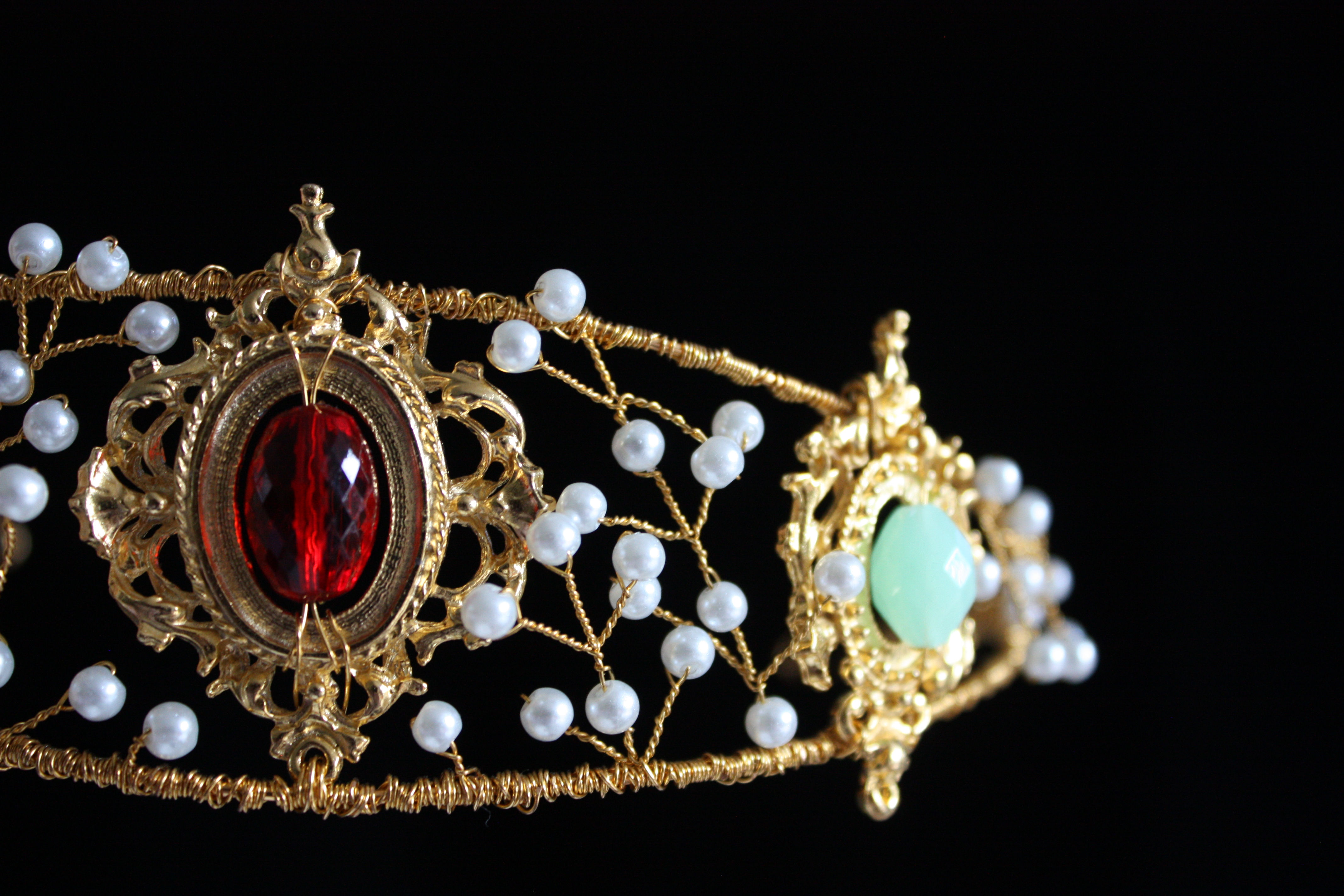 Gold tiara with red and mint green beads and crystals