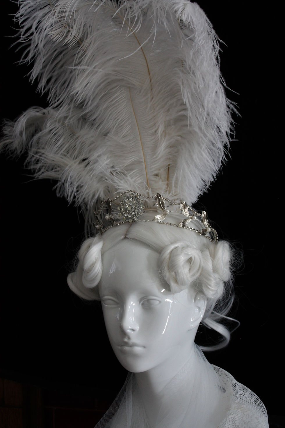 Regency style silver tiara with white feather headdress