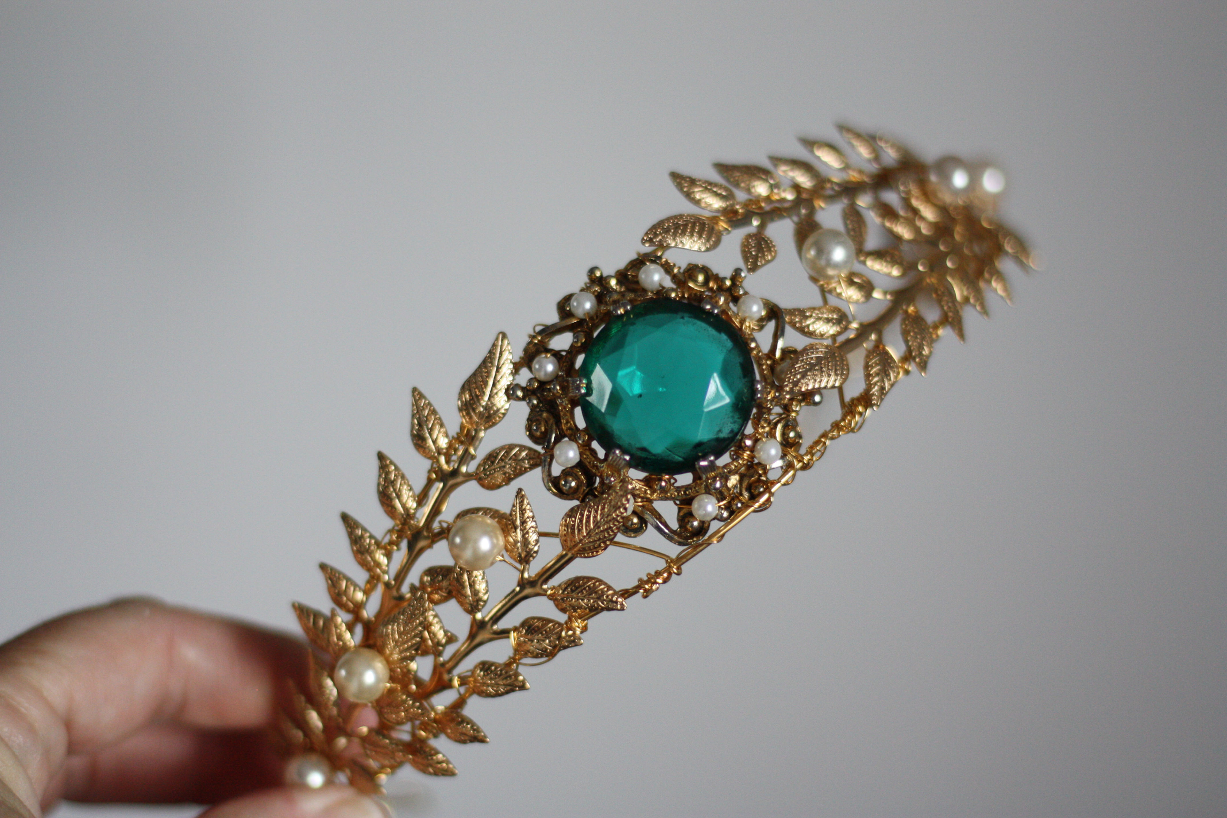 Gold handmade tiara with emerald stone