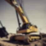 Caterpillar crane lowering a guitar amp electric guitars drums bass PA's down into hole in