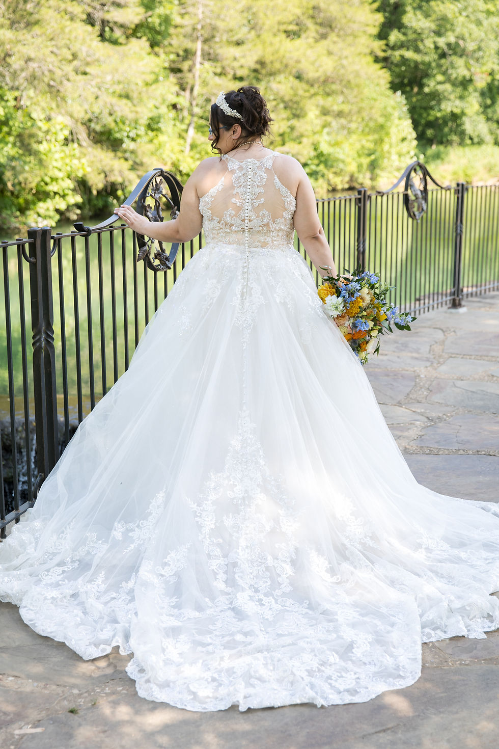 Bridal portrait, lace wedding dress, train detail