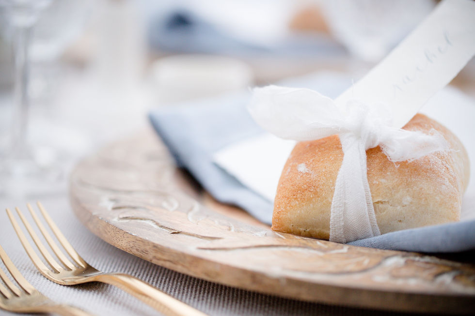 Wedding tablescape with charger, napkin, and roll