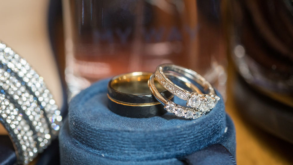 Detail photo of wedding rings and wedding shoe